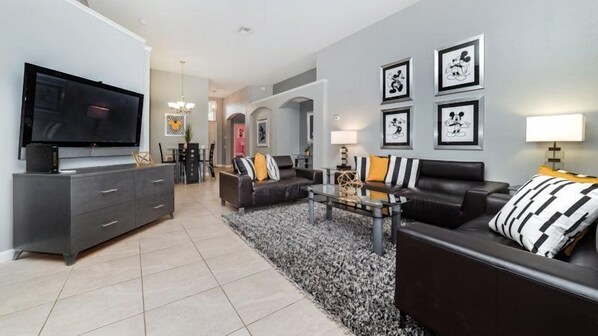 Televisión de pantalla plana, reproductor de DVD y tenis de mesa