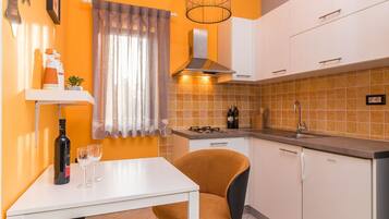 Fridge, microwave, stovetop, coffee/tea maker