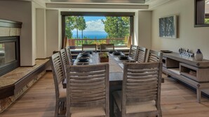 A spacious dining area with a long table, wooden chairs, and a view of the outdoors. - Incline Oasis - Incline Village Lakeview - TLUXP (Incline Village)