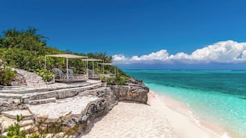 On the beach, sun loungers, beach towels
