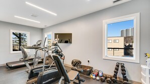 A gym with treadmills, a stationary bike, and free weights. - Lovely ski-in/out condo with gorgeous mountain views and shared tennis court (Sugar Mountain)