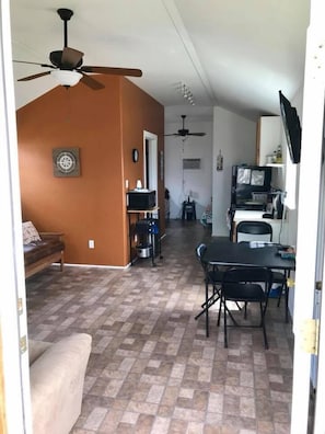 Basic Cabin, 1 Bedroom (Gone Coastal) | Living area | Flat-screen TV