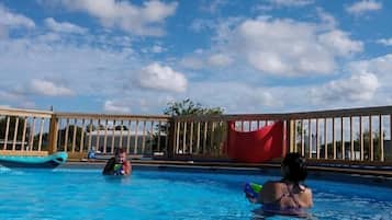 Outdoor pool, free pool cabanas, pool umbrellas