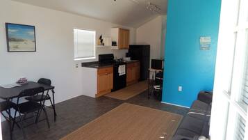 Basic Cabin, 1 Bedroom (Fishin Mission) | Living room | Flat-screen TV