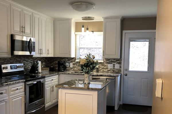 Kitchen leading to the back deck