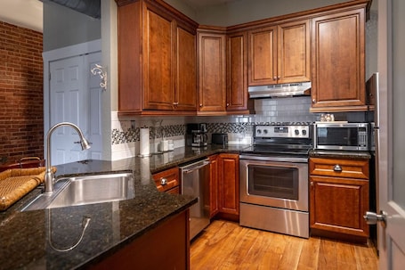 Fridge, microwave, oven, stovetop. Honeymoon Downtown Boutique Loft - Located in the Historic River District.