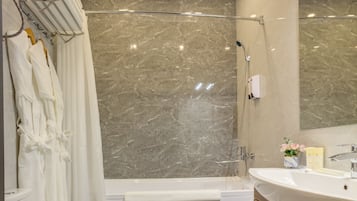Standard Triple Room | Bathroom | Rainfall showerhead, hair dryer, slippers, towels