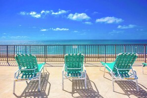 Three green chairs facing a beach with a clear sky. - Panoramic 9th fl. Oceanfront view, parking, pool (San Diego)