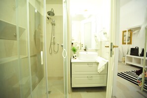 Shower, eco-friendly toiletries, hair dryer, bidet