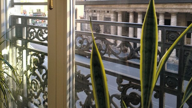 A balcony with ornate metal railings and a view of a historic building with multiple windows and balconies. - ♡♡♡ Norma ♡♡♡ (Roma)