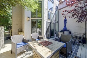 An outdoor patio with wicker furniture, a table with a centerpiece, and a barbecue grill. - Townhome ~ 4 Mi to Beaver Creek & 8 Mi to Vail! (Avon)