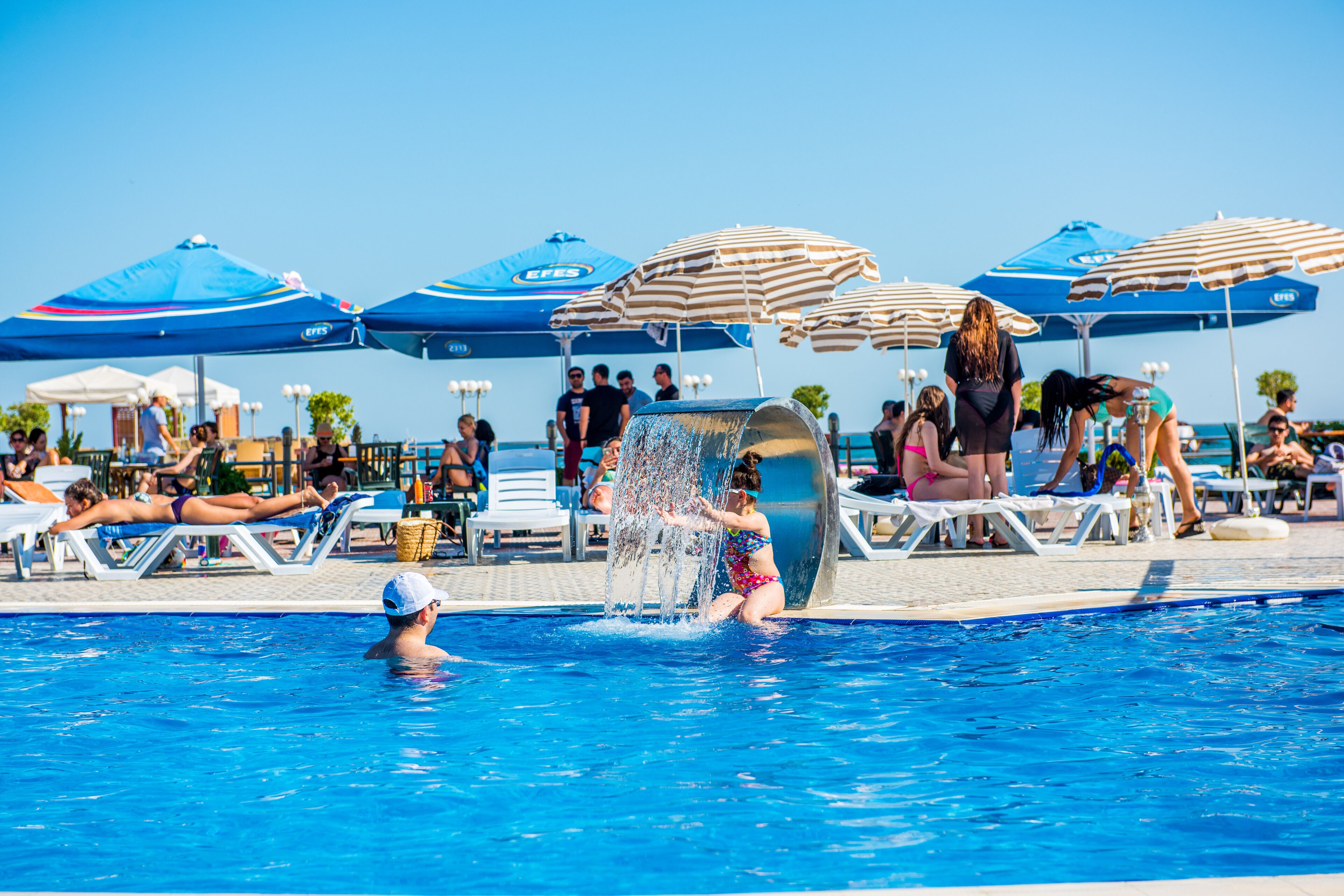 Outdoor pool, pool umbrellas, pool loungers