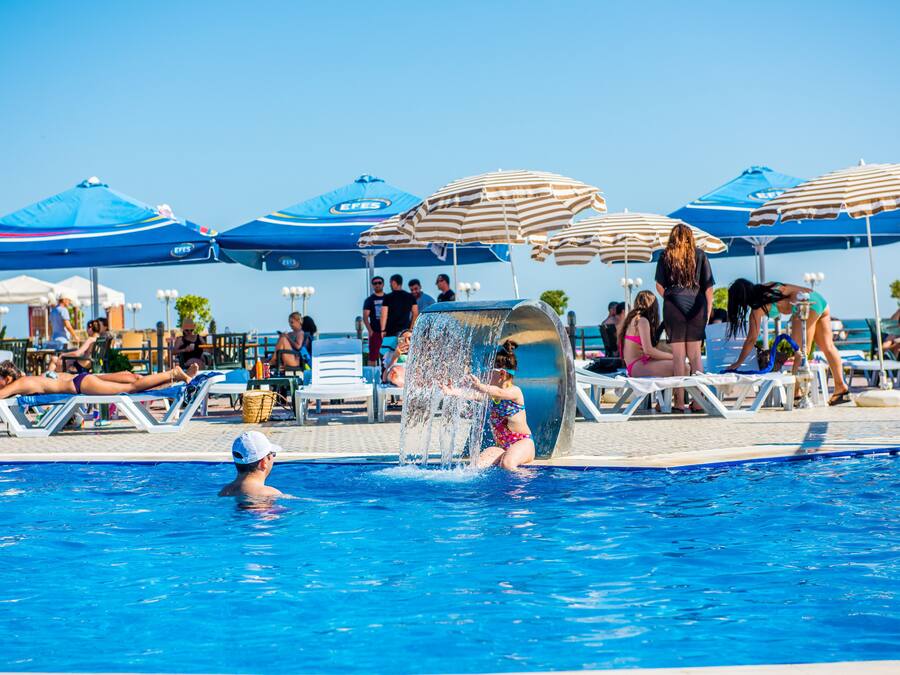Outdoor pool, pool umbrellas, sun loungers
