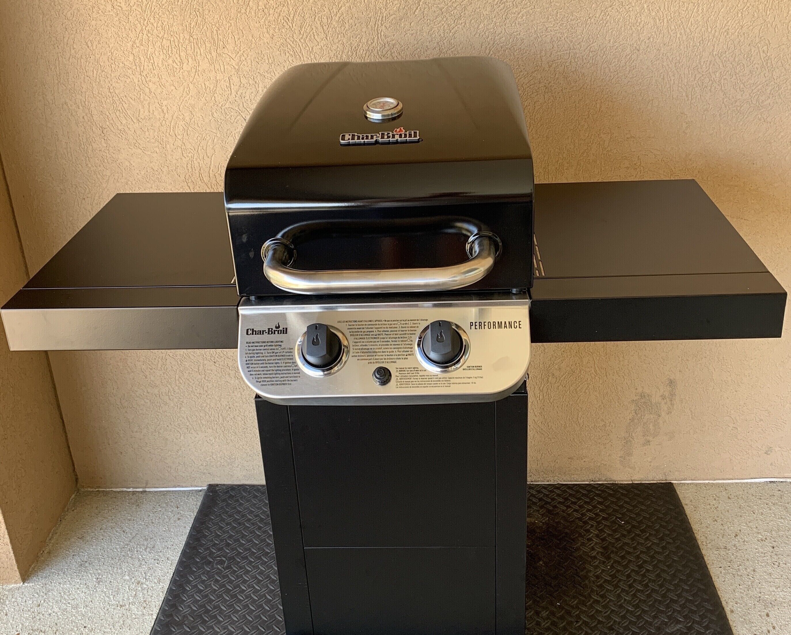A Char-Broil grill with a digital thermometer and control knobs.