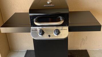 A Char-Broil grill with a digital thermometer and control knobs.
