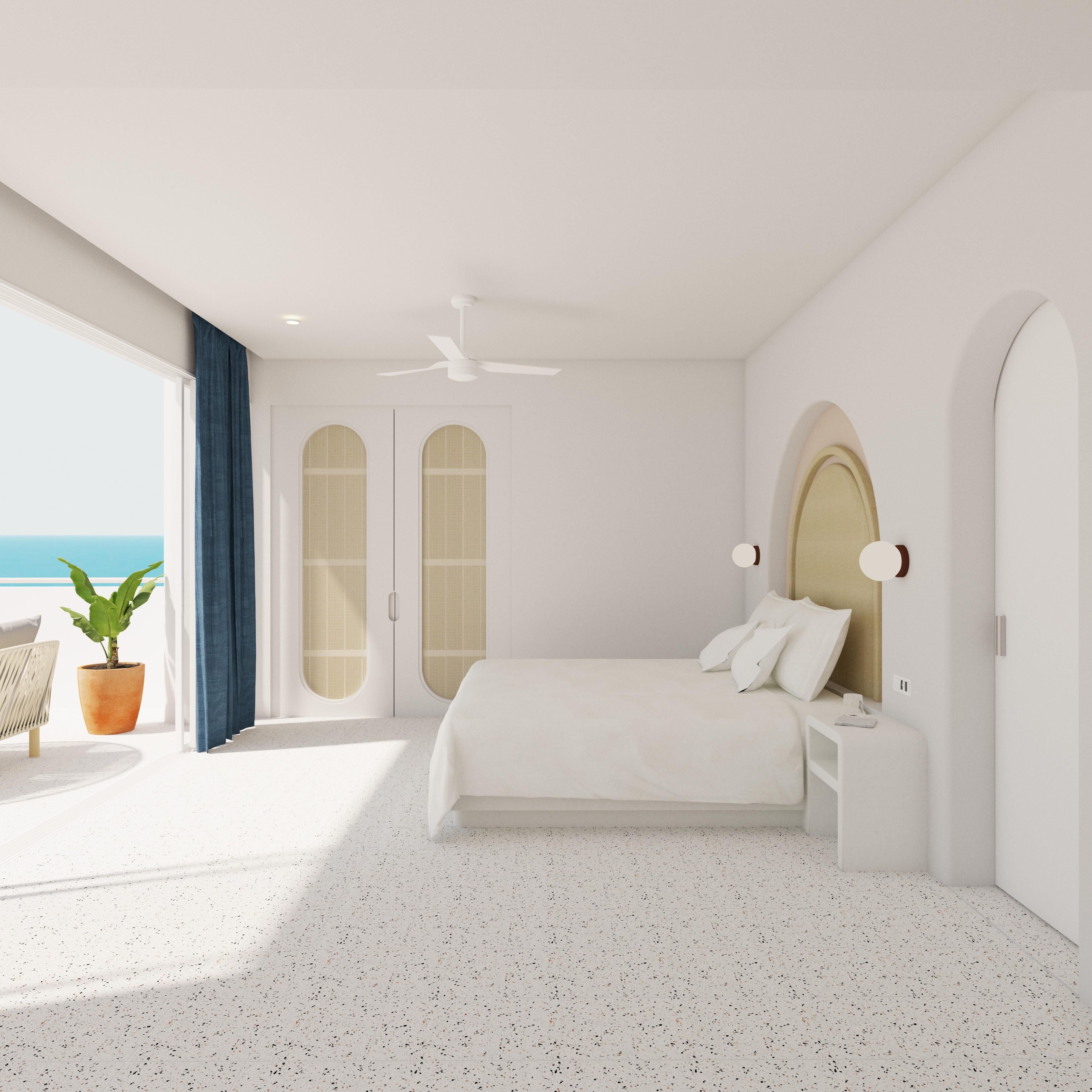 Un dormitorio moderno con una cama grande, un ventilador de techo y vista al mar.