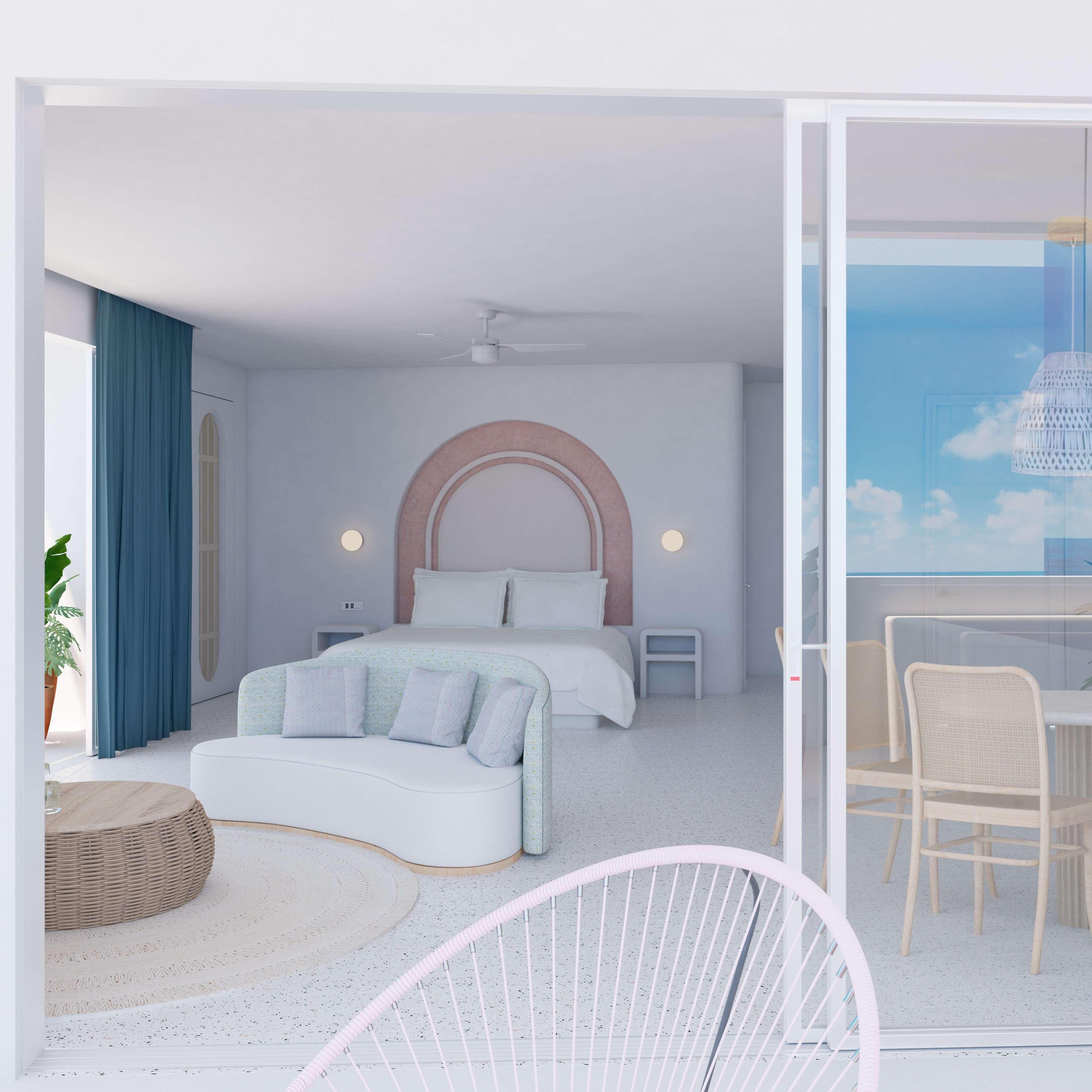 Un dormitorio moderno con cama, mesitas de noche, un rincón de descanso y vistas al cielo.