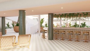 A modern interior with checkered flooring, wicker furniture, and a bar area with stools. - Perla La Paz, Tapestry Collection by Hilton (La Paz)