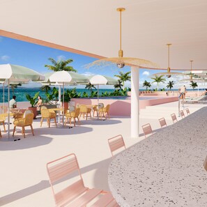 Un patio frente a la playa con mobiliario exterior, sombrillas y una zona de piscina.