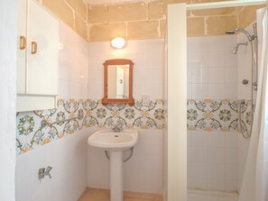 Shower, hair dryer, towels, toilet paper