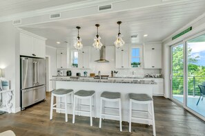 Fridge, microwave, oven, stovetop - Luxe AMI Stay! Saltwater Pool and Rooftop Views (Anna Maria)