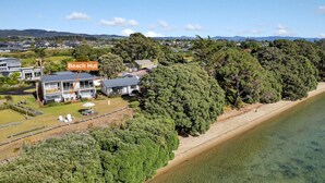A beachfront property with a large house labeled 'Beach Hut' and a sandy beach.
