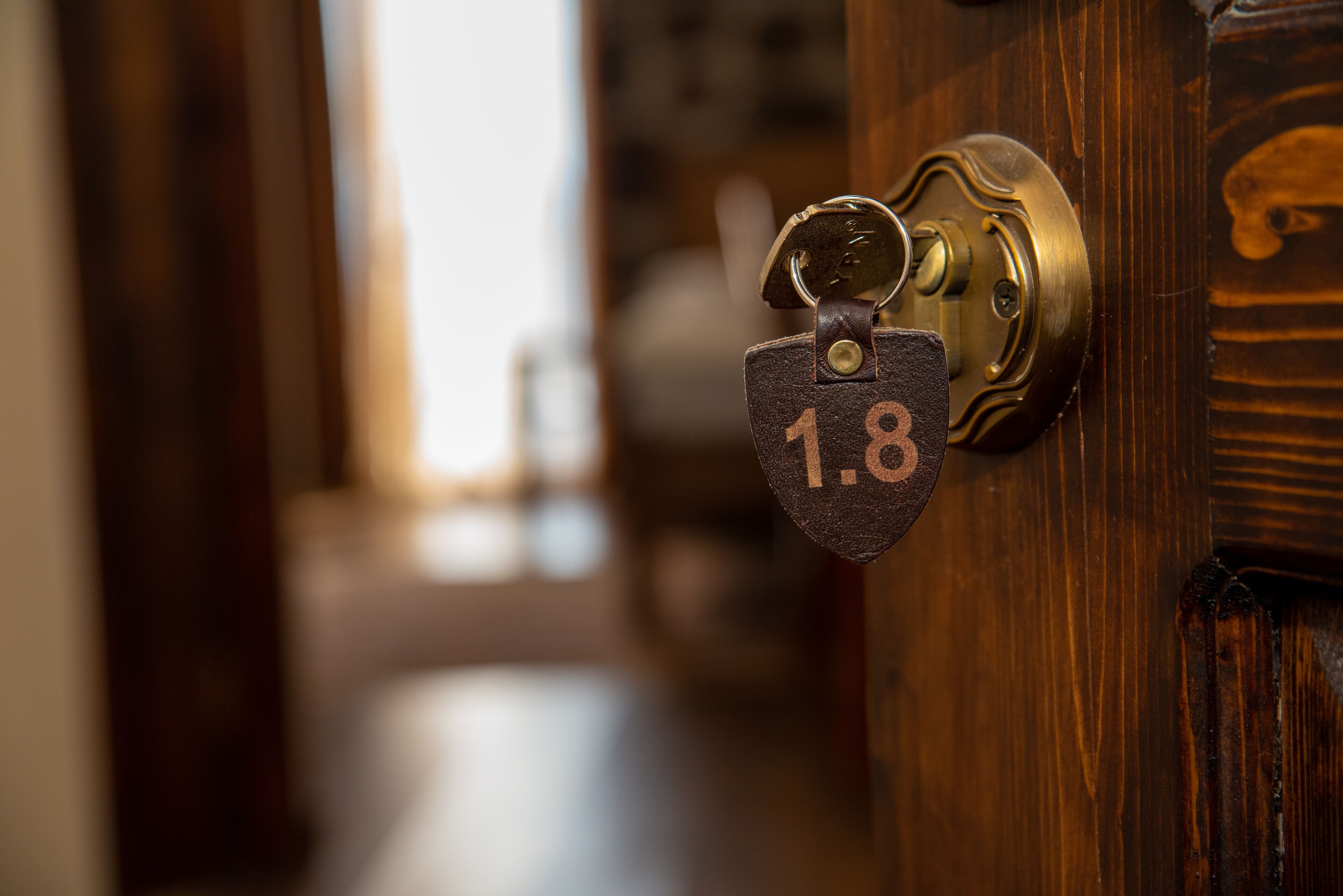 A close-up of a door lock with a keyhole and a brass lock mechanism.