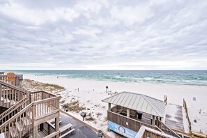 A beachside wooden structure with a sign reading "The Beach." - Ride the TIDE Beachside! 2Bd, 1B, Free Parking! Steps 2 Sand! 200 5 Star Reviews (Gulf Shores)