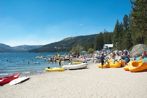 Guests can enjoy a variety of watercraft, including kayaks and paddleboards, in this family-friendly beach area.