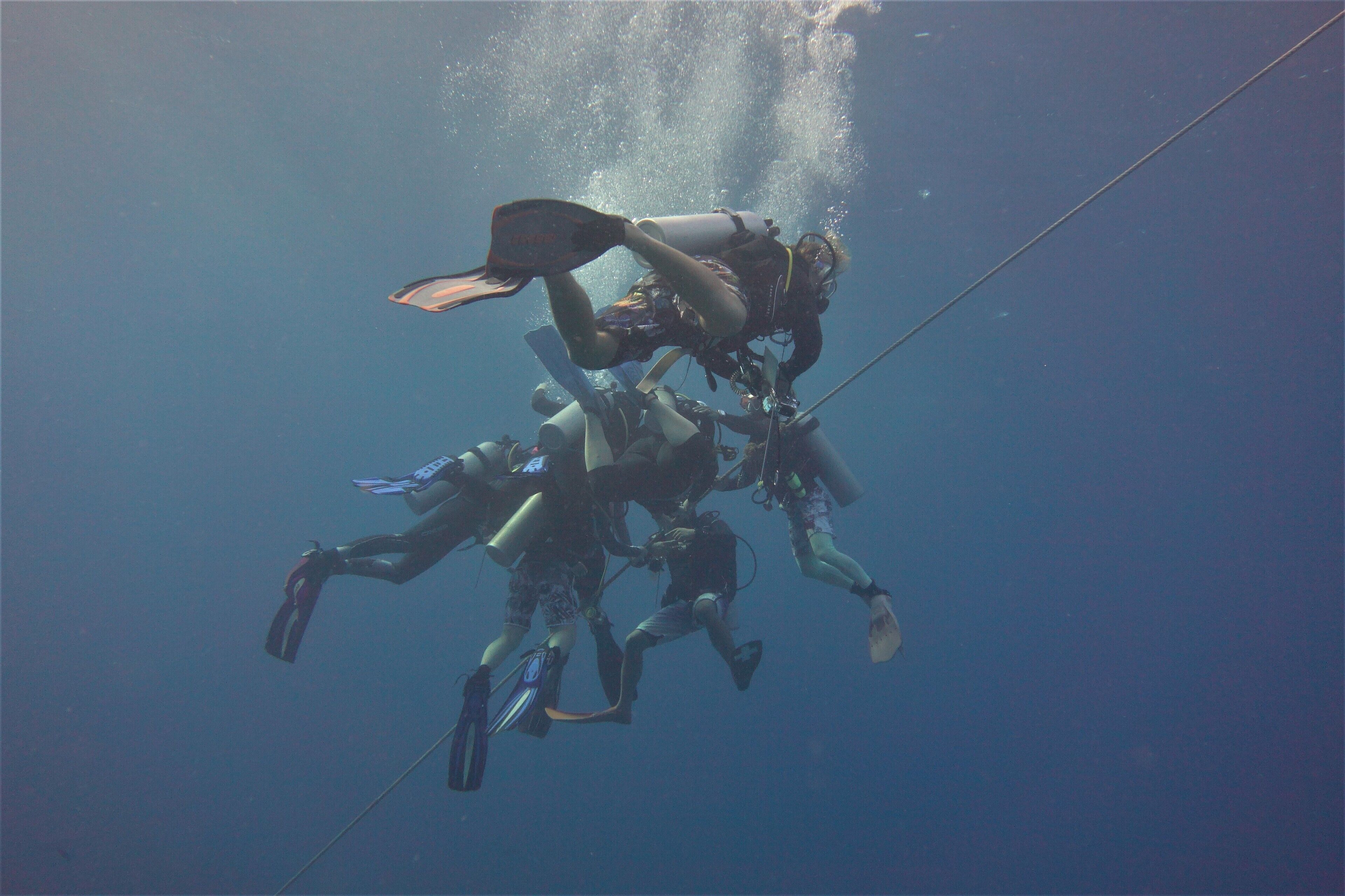 A diver underwater with a camera.