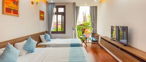 Family Room | Minibar, desk, blackout drapes, free WiFi