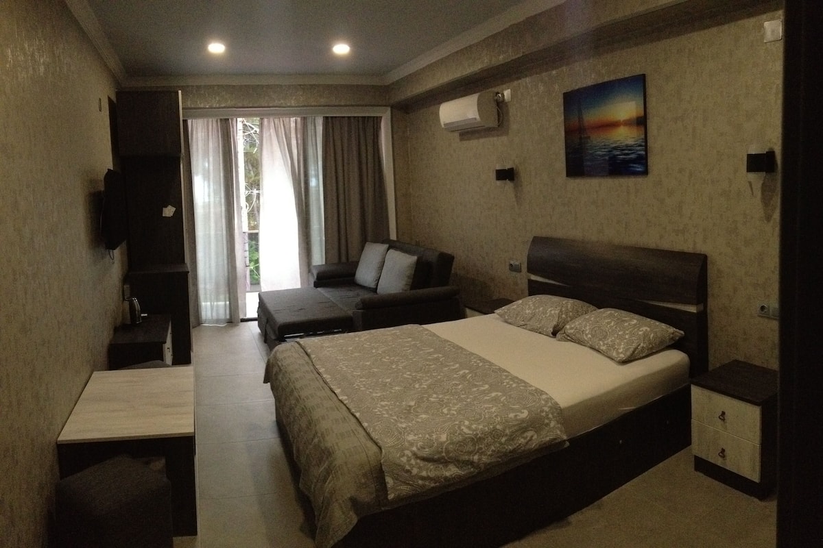 Luxury Triple Room, 1 Queen Bed with Sofa bed, Balcony, Partial Sea View | Hypo-allergenic bedding available, laptop workspace, blackout drapes