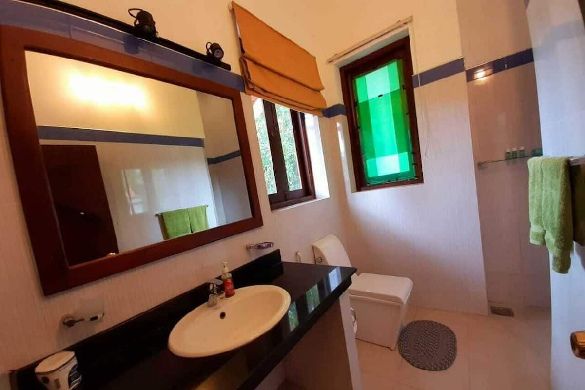 Jetted tub, rainfall showerhead, hair dryer, bathrobes