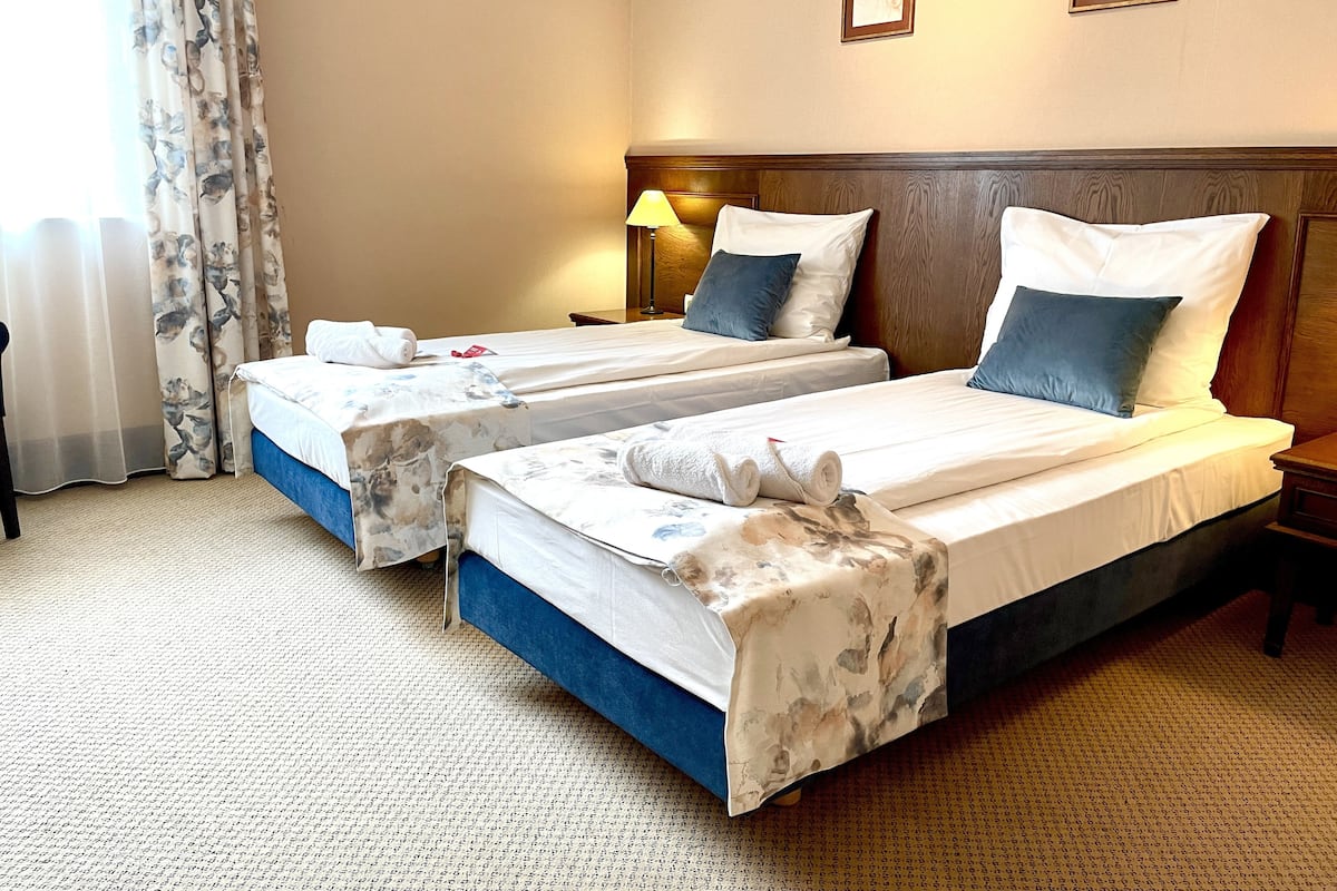 deluxe twin room | in-room safe, desk, laptop workspace, soundproofing