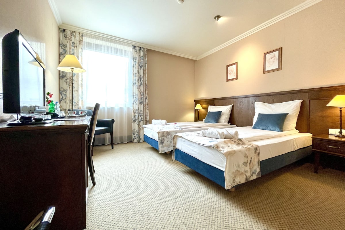 deluxe twin room | in-room safe, desk, laptop workspace, soundproofing