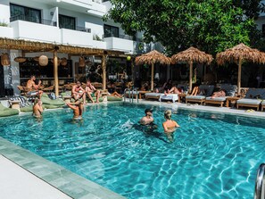 Seasonal outdoor pool, open 10:00 AM to 7:00 PM, pool loungers