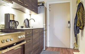 Fridge, stovetop, dishwasher, coffee/tea maker