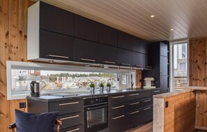 Fridge, stovetop, dishwasher, coffee/tea maker