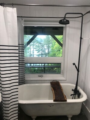 Bathtub, hair dryer, towels, soap