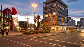 A modern hotel with a multi-story structure, large windows, and a flat roof. - The Muse Christchurch, Art Hotel (Christchurch)