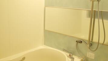 Combined shower/bathtub, free toiletries, hair dryer, bathrobes