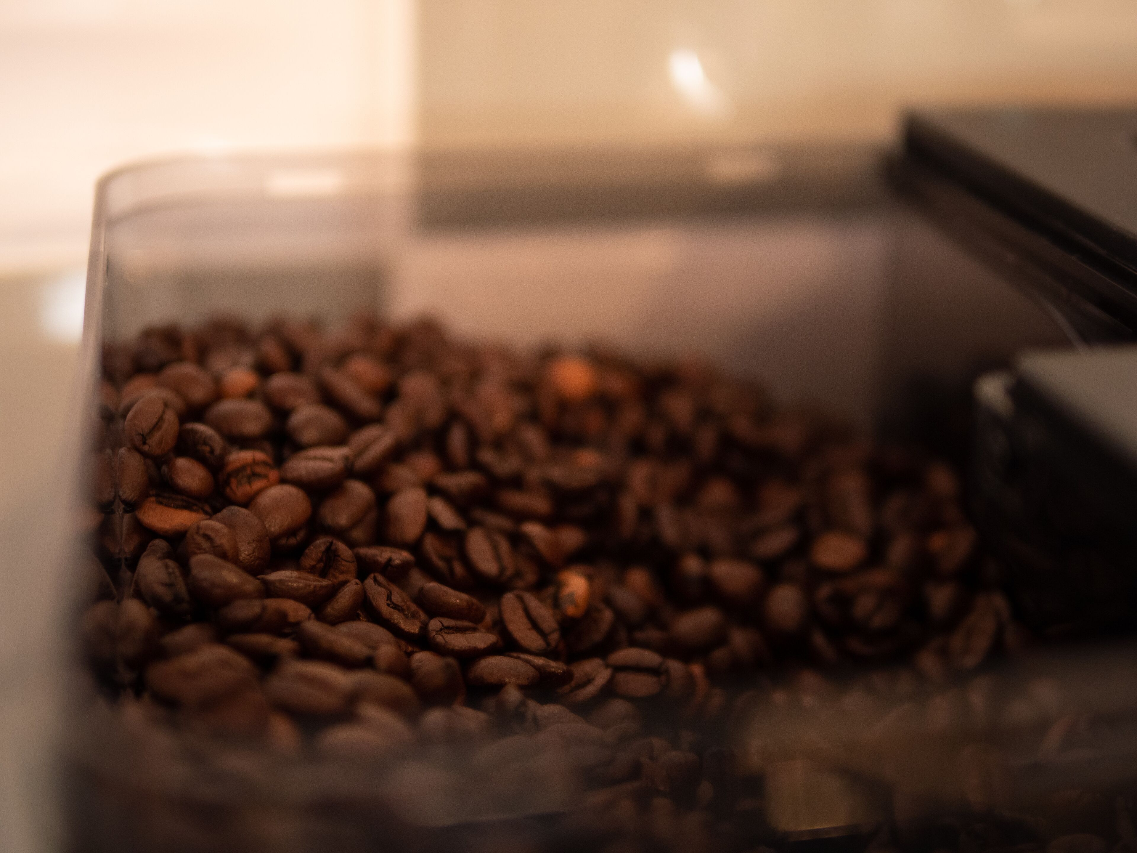 A container filled with coffee beans.