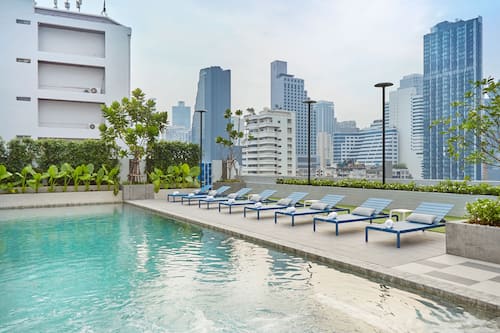 Outdoor pool, open 7:30 AM to 9:00 PM, pool loungers