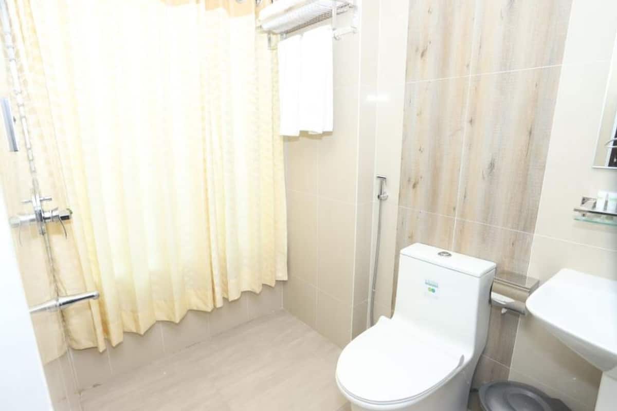 shower, rainfall showerhead, slippers, towels