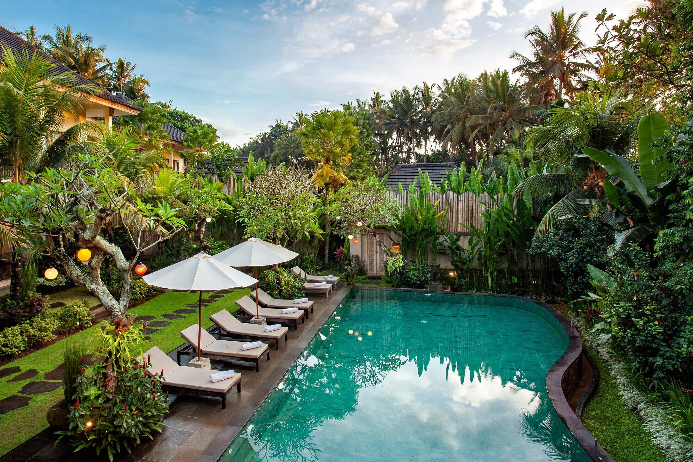 Outdoor pool, open 7:00 AM to 7:00 PM, pool umbrellas, pool loungers