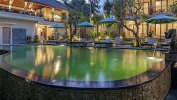 Outdoor pool, open 7:00 AM to 7:00 PM, pool umbrellas, pool loungers