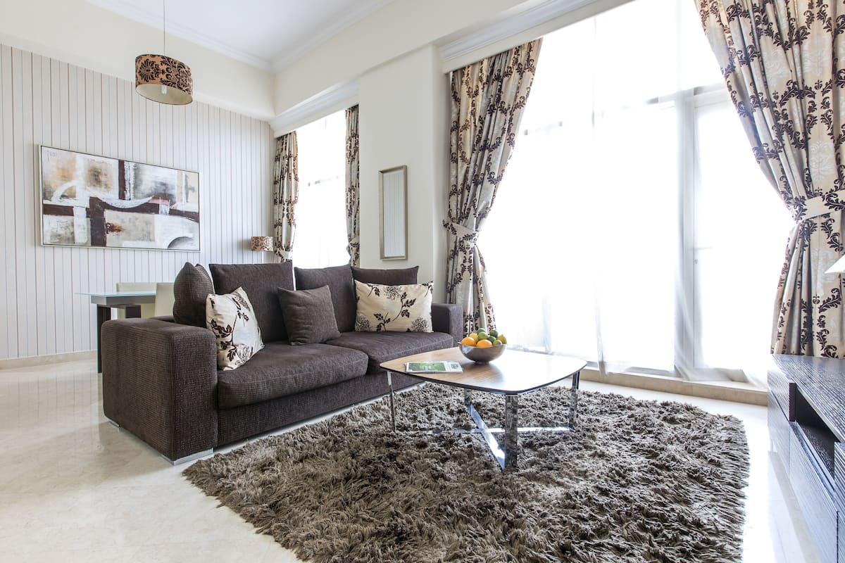 Deluxe Apartment, 2 Bedrooms | Living area | LED TV, pay movies