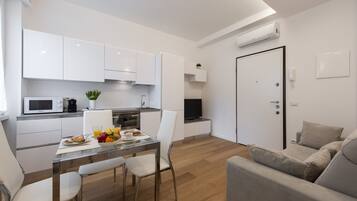 Apartment, 1 Bedroom | Living room | 32-inch flat-screen TV with digital channels, TV