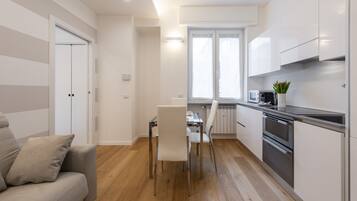 Apartment, 1 Bedroom | Living area | 32-inch flat-screen TV with digital channels, TV