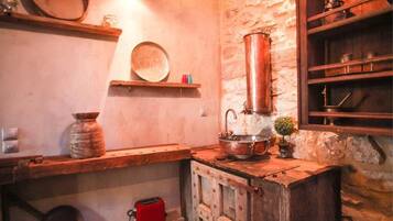 Apartment | Private kitchenette | Fridge, stovetop, electric kettle, cookware/dishes/utensils